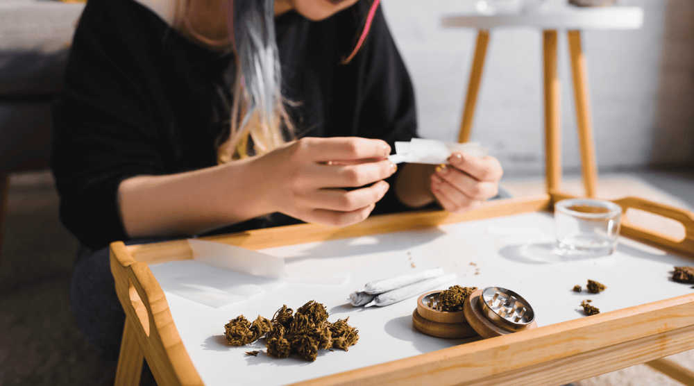 weed anxiety, image showcasing a girl rolling a joint